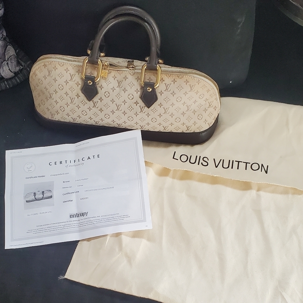 Louis Vuitton Alma Monogram Mini Lin Handbag Brown